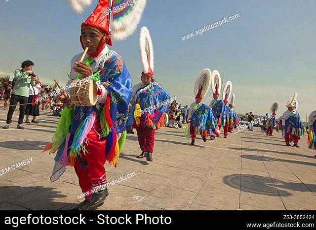 Totonacan indigenous dancers from Papantla-Veracruz in traditional costumes, perform the Dance of the Guaguas at the pilgrimage to Our Lady of Guadalupe...
