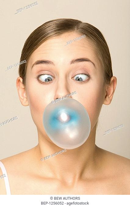Portrait of a girl with a bubble gum