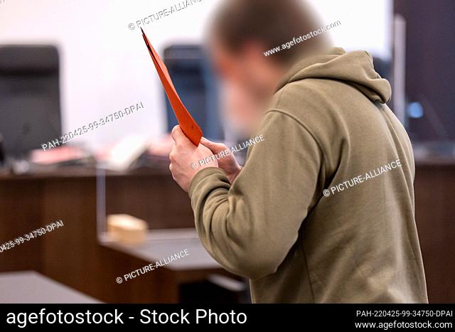 25 April 2022, Bavaria, Nuremberg: An accused man arrives at the courtroom of the Criminal Justice Center of the Nuremberg-Fürth Regional Court at the start of...