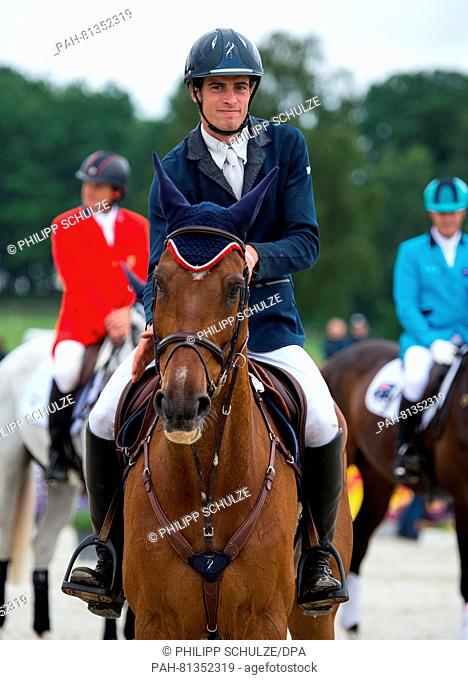 The French Maxime Livio smiles on his horse Qalao des Mers placing second at the four star tests of Eventing riders in Luhmuehlen, Germany, 19 June 2016