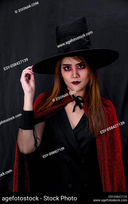 Portrait of asian young adult teenage woman wear Halloween costume cloth for Halloween party carnival. Halloween celebrate and international holiday concept
