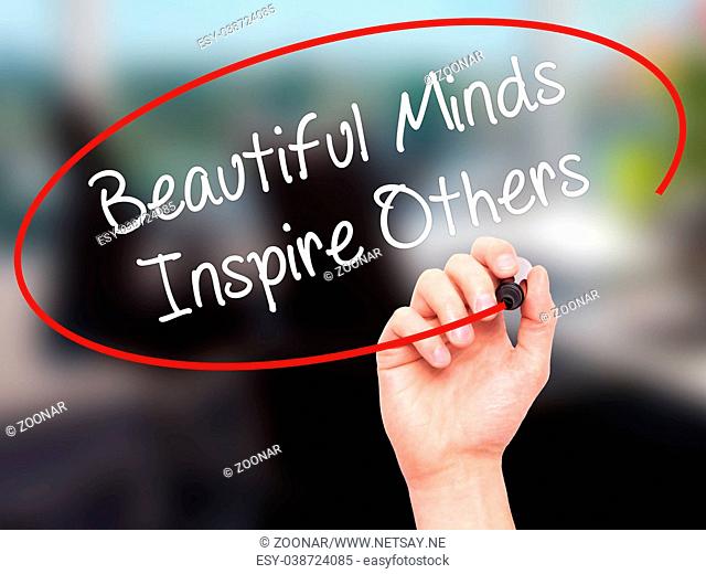 Man Hand writing Beautiful Minds Inspire Others with black marker on visual screen