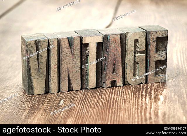 vintage word made from wooden letterpress type on grunge wood