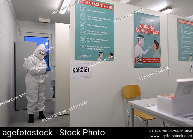 02 February 2021, Saxony, Dresden: An employee of the company CoviMedical UG prepares a rapid test for the coronavirus in the morning at the Corona Test Centre...
