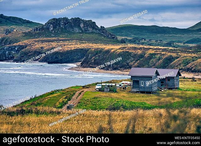 Scenic view of sea and landscape against cloudy sky, Krabbe Peninsula, Russia