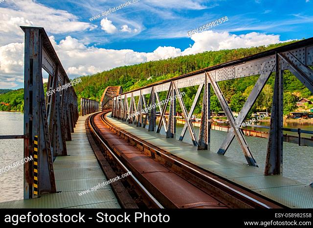 Single track railway bridge over the Vltava river, Mechenice, Czech Republic. Autumn scenery