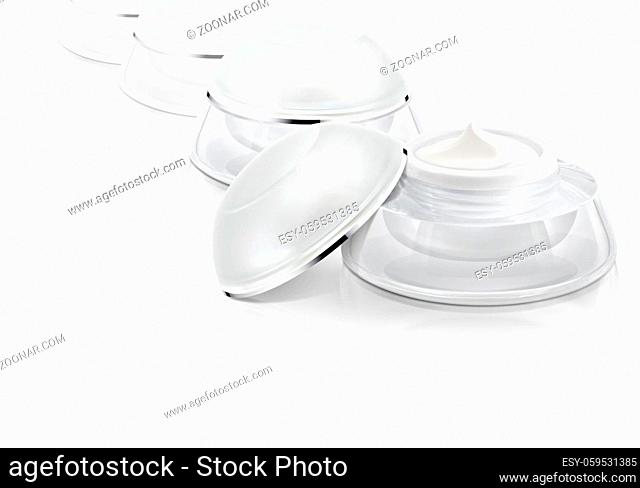 Several white rounded cosmetic jar on white background