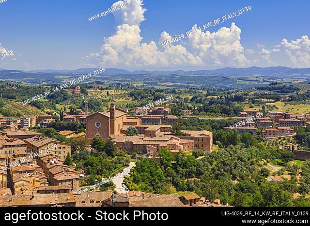 Siena, Siena Province, Tuscany, Italy. The basilica church of San Francesco with Tuscan countryside beyond