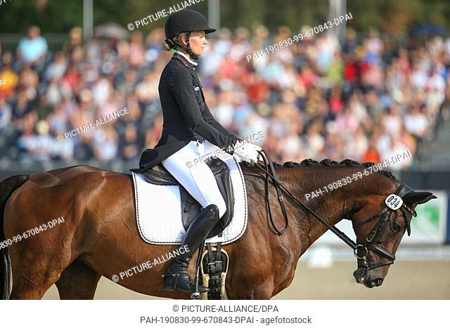 30 August 2019, Lower Saxony, Luhmühlen: Equestrian sport, eventing, European Championships: The German event rider Anna Siemer on FRH Butt's Avondale rides in...