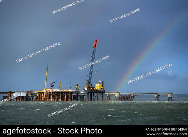 16 September 2022, Lower Saxony, Wilhelmshaven: A rainbow over the future import terminal for liquefied natural gas (LNG)
