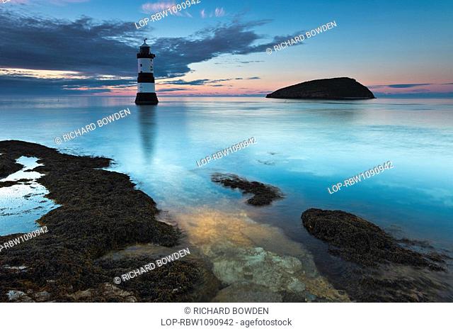 Wales, Anglesey, Penmon, Penmon lighthouse and Puffin Island at Penmon Point on the Isle of Anglesey