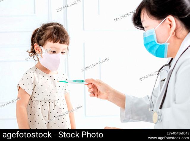 Sick child with flu fever and doctor masure with thermometer