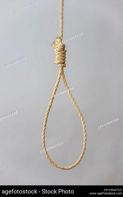 knotted gallows rope on grey background