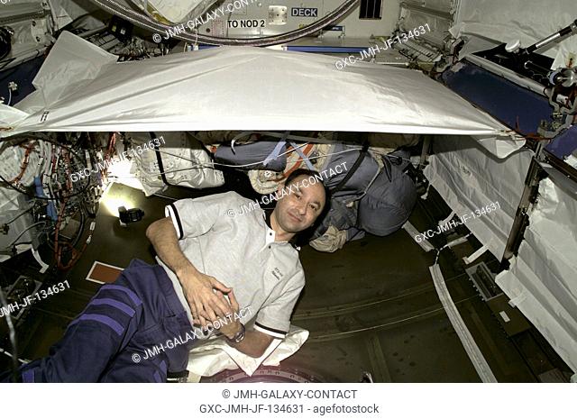 Astronaut Mark L. Polansky is pictured in the new Destiny laboratory. The STS-98 and Expedition One crews have been busy in the lab since its hatch was opened...
