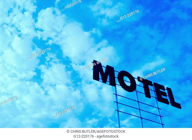 Old motel sign and clouds with tungsten blue cast