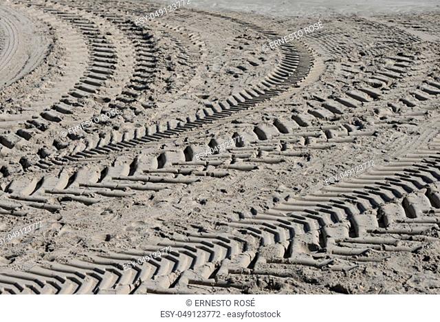Tire tracks on the sandy beach in the province of Malaga, Spain