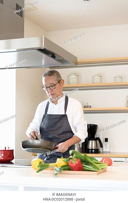 Scene of Senior man cooking