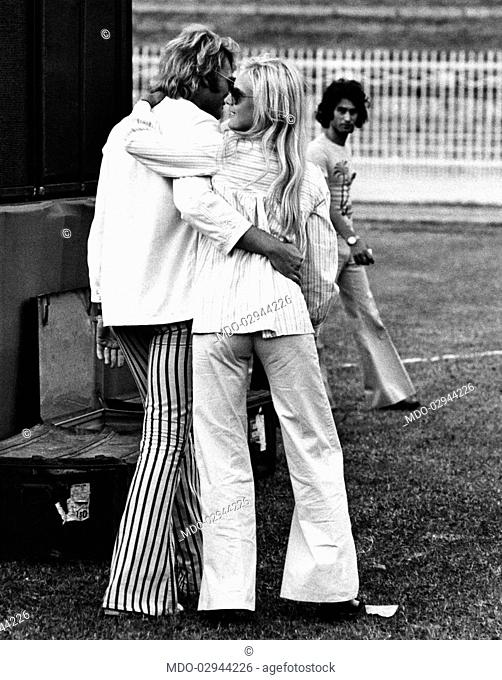 Bulgarian-born French singer Sylvie Vartan hugging her husband, French singer and actor Johnny Hallyday (Jean-Philippe Smet). Milan, 1973