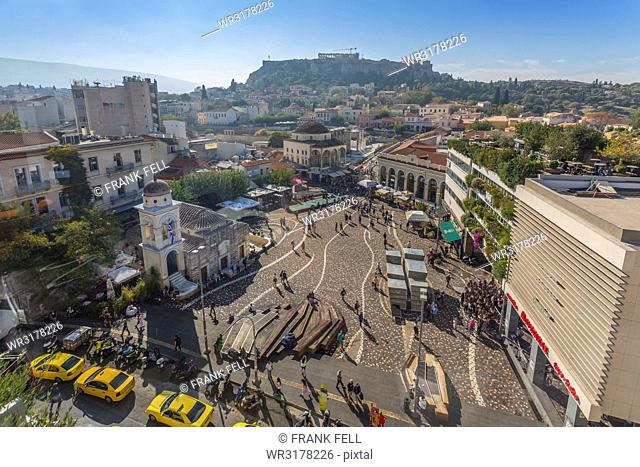 Elevated view of taxis, shoppers and Greek Orthodox Church in Monastiraki Square, Acropolis visible in background, Monastiraki District, Athens, Greece, Europe