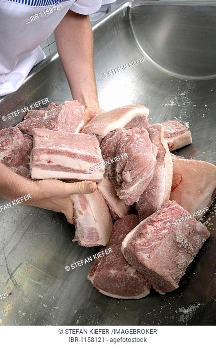 Production of the bavarian specialty Schwarzgeraeuchertes, smoked ham in a butchery in Hengersberg, Bavaria, Germany, Europe