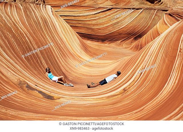 People in the wave, Vermilion North Coyote Buttes  PariaCanyon-Vermilion Cliffs Wilderness, Vermilion Cliffs National Monument, Arizona, USA