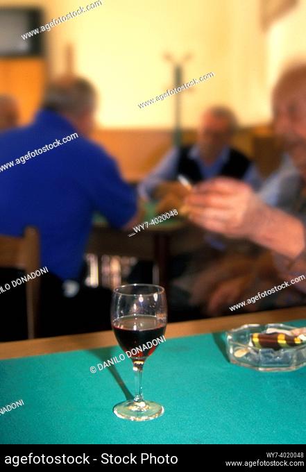 glass of red wine in a bar, alzano lombardo, italy