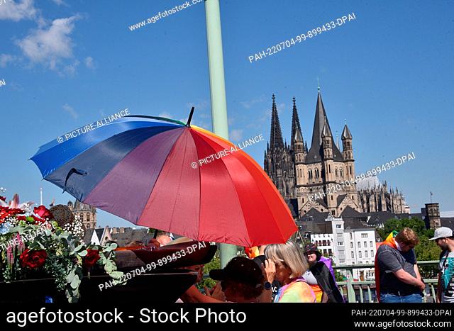 03 July 2022, North Rhine-Westphalia, Cologne: Participants of the Christopher Street Day (CSD) in Cologne. At the parade with this year's motto ""For human...