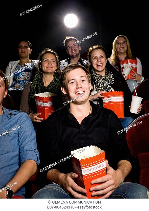 Man at the cinema with popcorn