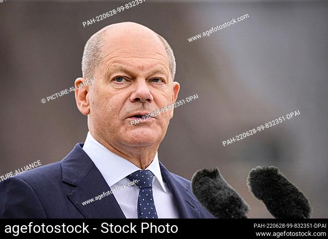 28 June 2022, Bavaria, Elmau: German Chancellor Olaf Scholz (SPD) speaks during a press conference at the end of the G-7 summit at Schloss Elmau