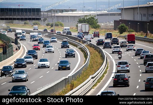 30 July 2022, Baden-Wuerttemberg, Stuttgart: Cars drive along the A8 highway near Stuttgart Airport. The first vacation weekend was busy in Baden-Württemberg at...