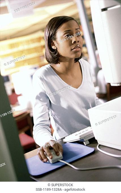Teenage girl working on a computer