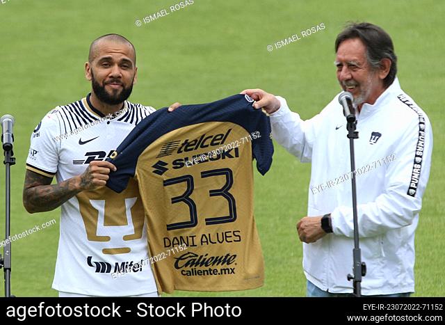 July 23, 2022, Mexico City, Mexico: Brazilian Dani Alves receives his official Pumas' jersey from club president Leopoldo Silva during his presentation as a new...