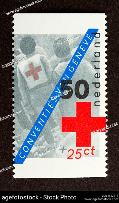 HOLLAND - CIRCA 1980: Stamp printed in the Netherlands shows a red cross, circa 1980