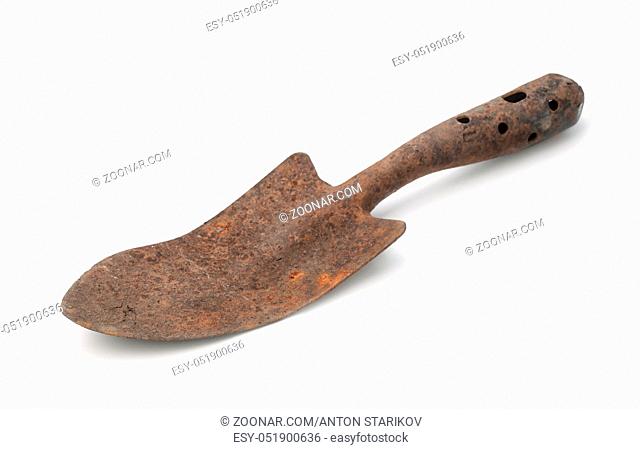 Old rusty garden trowel isolated on white