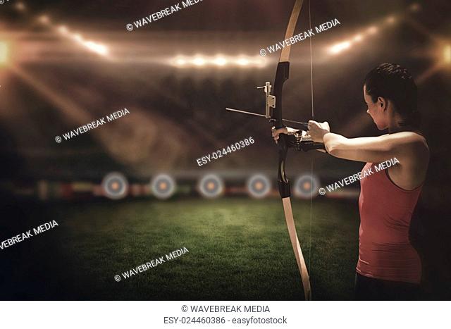 Side view of woman practicing archery
