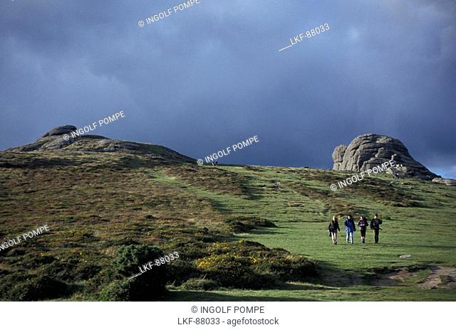 Hay Tor, group of hikers in foreground, Dartmoor, Devon, England, United Kingdom