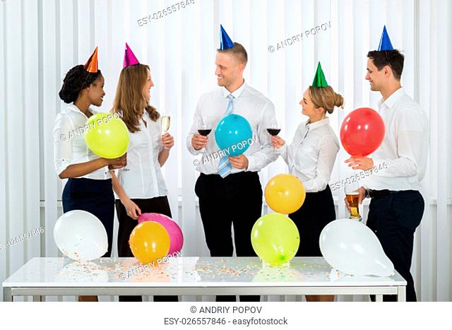 Team Of Happy Businesspeople Having Champagne In Office