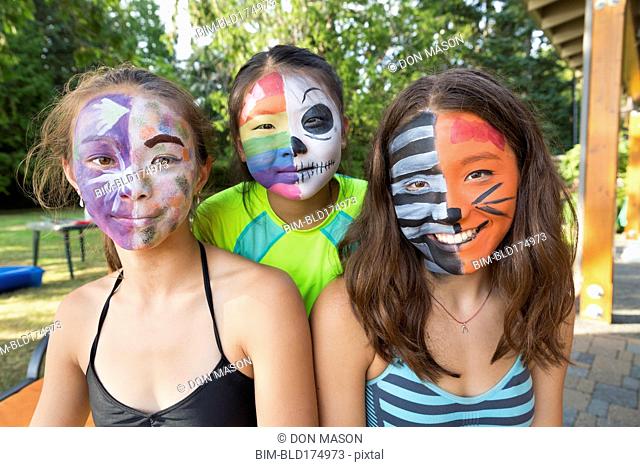 Smiling girls wearing face paint