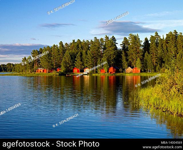 europe, sweden, dalarna, autumn mood at a forest lake, mora, siljan lake, sollerön island, boathouses for church naves