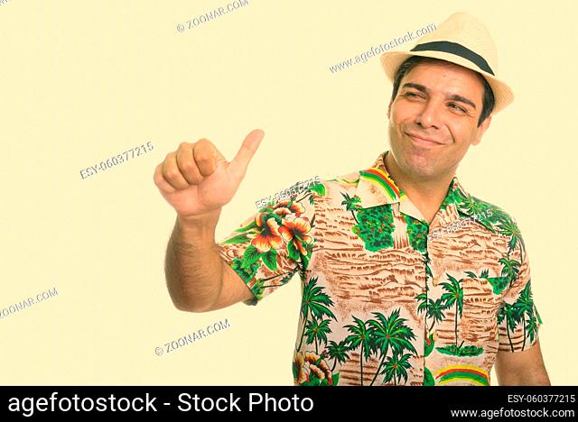 Studio shot of handsome Persian man isolated against white background