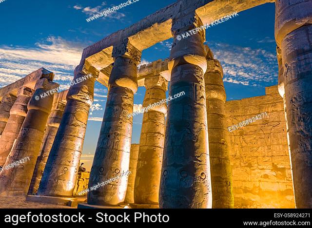 Illuminated columns in Luxor Temple at sunset, Egypt