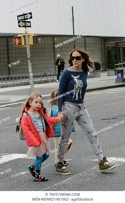 Sarah Jessica Parker takes her twin daughters Tabitha and Marion Broderick to school wearing scruffy jogging bottoms, high top trainers