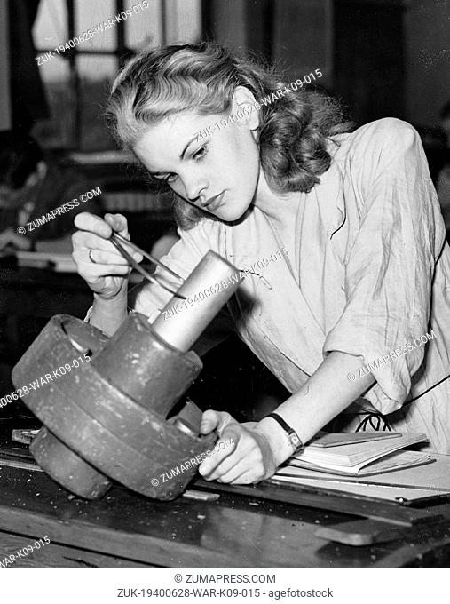 June 28, 1940 - London, England, U.K. - This young woman is one of ninety training at the Beaufoy Institute in Lambeth. She is here learning how to use...