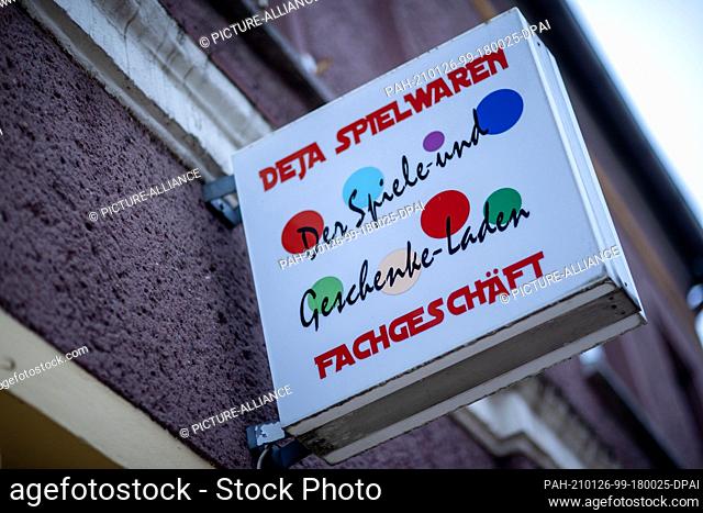 12 November 2020, Mecklenburg-Western Pomerania, Wittenburg: In the window of the shop ""Deja Spielwaren"" is informed about the lowered prices
