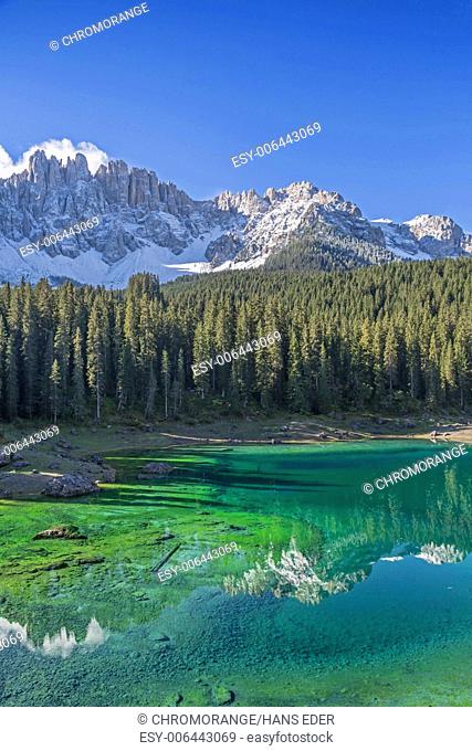 An idyllic small mountain lake on the Karerpass in South Tyrol