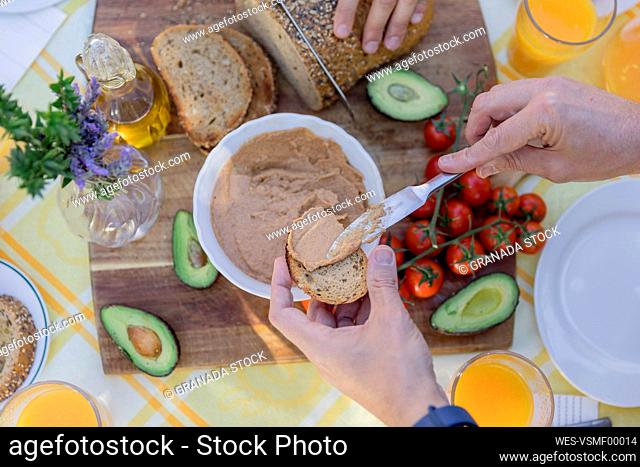 Close-up of friends enjoying a healthy vegan breakfast outdoors