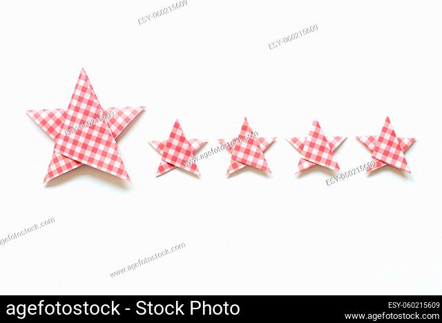 Red check pattern Five stars quality rating on white background. top view