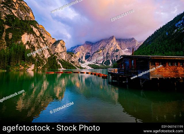 Beautiful landscape of Braies Lake Lago di Braies, romantic place with wooden bridge and boats on the alpine lake, Alps Mountains, Dolomites, Italy, Europe