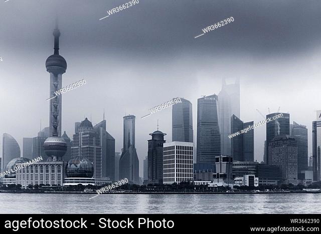 China, Shanghai, Financial District with dramatic sky