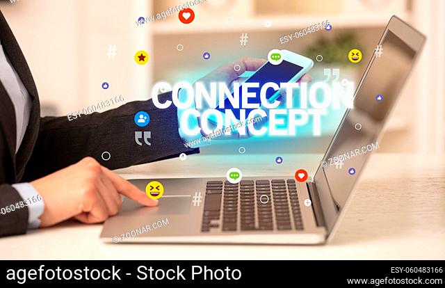 Freelance woman using laptop with CONNECTION CONCEPT inscription, Social media concept